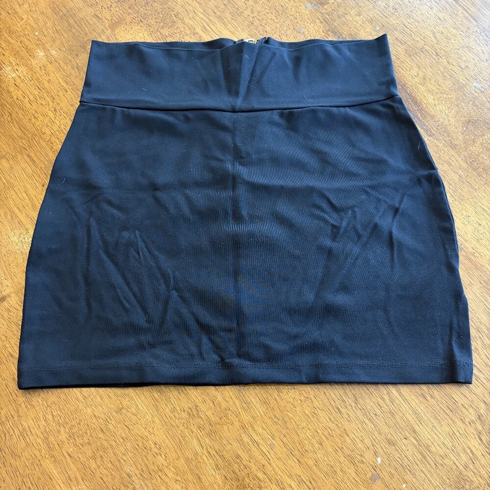 BEBE Black zip up skirt - Size Medium